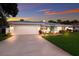 Charming home with a well-kept lawn and a spacious driveway leading to the garage at 1915 38Th W St, Bradenton, FL 34205