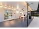 Inviting outdoor patio featuring string lights, a dining area, and a cozy ambiance at 1915 38Th W St, Bradenton, FL 34205
