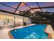 A relaxing screened-in pool and patio area perfect for outdoor entertaining and enjoyment at 1915 38Th W St, Bradenton, FL 34205