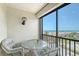 A perfect spot to relax, this outdoor patio includes seating and stunning views of the ocean at 2045 Gulf Of Mexico Dr # M1-515, Longboat Key, FL 34228