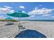 Beautiful beach featuring white sand and stunning sky, complete with chairs and umbrellas for ultimate relaxation at 2045 Gulf Of Mexico Dr # M1-515, Longboat Key, FL 34228