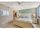 Comfortable bedroom featuring a queen bed, coastal-themed decor, and a view into the bathroom at 2045 Gulf Of Mexico Dr # M1-515, Longboat Key, FL 34228