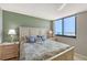 Bedroom boasting ocean views, a queen bed, coastal decor, and side tables with lamps at 2045 Gulf Of Mexico Dr # M1-515, Longboat Key, FL 34228