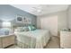 Cozy bedroom featuring a queen bed, coastal-themed decor, and ample closet space at 2045 Gulf Of Mexico Dr # M1-515, Longboat Key, FL 34228