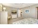 Comfortable bedroom featuring a TV, chest of drawers, and an open doorway at 2045 Gulf Of Mexico Dr # M1-515, Longboat Key, FL 34228