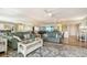 Spacious living room with a relaxing vibe, comfortable furniture, and a peek at the balcony at 2045 Gulf Of Mexico Dr # M1-515, Longboat Key, FL 34228