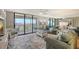 Inviting living room with plush sofas, a cozy rug, and access to a balcony with beautiful views at 2045 Gulf Of Mexico Dr # M1-515, Longboat Key, FL 34228