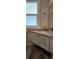 Bathroom sink area with granite countertop and window allowing for natural light at 219 24Th W St, Bradenton, FL 34205
