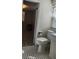 Bathroom showcasing patterned tile flooring, a toilet, and vanity at 219 24Th W St, Bradenton, FL 34205