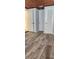 View of the bedroom with hardwood style floors and multiple closets at 219 24Th W St, Bradenton, FL 34205
