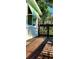 Outdoor deck surrounded by lush foliage, showing awning and natural light at 219 24Th W St, Bradenton, FL 34205