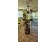 Eclectic dining area with unique table, chairs, chandelier, and views to the backyard at 219 24Th W St, Bradenton, FL 34205