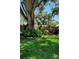 Lush front yard with beautiful foliage and landscaping enhancing the property's curb appeal at 219 24Th W St, Bradenton, FL 34205