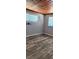 Cozy room featuring wood-look floors and two windows at 219 24Th W St, Bradenton, FL 34205