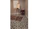 Room showcasing patterned tile flooring, an easel, and a small side table at 219 24Th W St, Bradenton, FL 34205