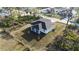 Aerial view of the home's backyard and neighborhood, highlighting its privacy and proximity to other residences at 2323 Zuyder Ter, North Port, FL 34286