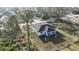 Aerial view of a home surrounded by lush greenery and neighboring houses, showcasing a peaceful setting at 2323 Zuyder Ter, North Port, FL 34286