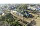 Aerial view of a home nestled among trees and greenery, highlighting its location in a serene environment at 2323 Zuyder Ter, North Port, FL 34286
