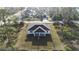 Aerial view showcasing the home's backyard and surrounding landscape, emphasizing privacy and space at 2323 Zuyder Ter, North Port, FL 34286