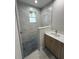 Bathroom showcasing tiled shower and floor with stylish modern vanity at 2323 Zuyder Ter, North Port, FL 34286