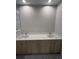 Bathroom with double sink vanity, quartz counters, and modern fixtures at 2323 Zuyder Ter, North Port, FL 34286