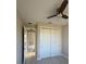 Bedroom showcasing a closet and ceiling fan, designed with neutral decor at 2323 Zuyder Ter, North Port, FL 34286