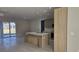 Modern kitchen featuring an island with seating, stainless steel appliances, and sleek cabinetry at 2323 Zuyder Ter, North Port, FL 34286