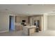 Contemporary kitchen featuring an island with seating, stainless steel appliances, and custom cabinetry at 2323 Zuyder Ter, North Port, FL 34286