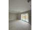 Open concept living room with recessed lighting and large sliding glass doors at 2323 Zuyder Ter, North Port, FL 34286
