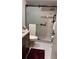 Bathroom showcasing a tiled shower with glass door and updated fixtures at 2841 74Th St W # 2841, Bradenton, FL 34209