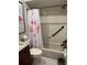 Bathroom featuring a tub with shower, flamingo shower curtain, and vanity with storage at 2841 74Th St W # 2841, Bradenton, FL 34209