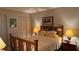 Cozy bedroom with warm lighting, a comfortable bed, and a neutral color scheme at 2841 74Th St W # 2841, Bradenton, FL 34209