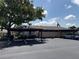 Exterior view of condo with carports, manicured landscaping, and plenty of parking at 2841 74Th St W # 2841, Bradenton, FL 34209