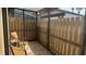 Covered lanai features wood floors, a fence and two chairs at 2841 74Th St W # 2841, Bradenton, FL 34209