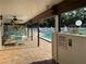 Community pool area with plenty of chairs and tables for residents to relax near the water at 2841 74Th St W # 2841, Bradenton, FL 34209