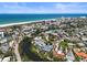 Waterfront property aerial view showcasing canal access, surrounding landscape, and beach proximity at 30 Island Cir, Sarasota, FL 34242