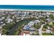Waterfront property with canal access, a boat dock, and stunning beach views from above at 30 Island Cir, Sarasota, FL 34242