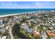 Stunning aerial view of property on a canal with beach access and city views at 30 Island Cir, Sarasota, FL 34242