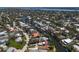 Stunning aerial view of a neighborhood with waterfront homes along canals and lush trees at 30 Island Cir, Sarasota, FL 34242
