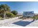 Sandy path leads to Siesta Beach, ranked #1 in the USA, under a sunny sky at 30 Island Cir, Sarasota, FL 34242
