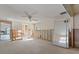 Open bedroom featuring an overhead fan, neutral walls, and sliding glass mirror doors at 30 Island Cir, Sarasota, FL 34242