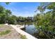 Waterfront property with a private dock and boat lift, offering direct access to the canal at 30 Island Cir, Sarasota, FL 34242