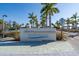 Entrance to Siesta Beach, Sarasota County Park, with lush landscaping and clear signage at 30 Island Cir, Sarasota, FL 34242