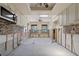 Bright, unfinished kitchen featuring a skylight, ceiling fan, and tile backsplash at 30 Island Cir, Sarasota, FL 34242