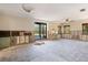 An unfinished living room with exposed wall studs and a sliding glass door to outdoors at 30 Island Cir, Sarasota, FL 34242