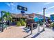 Charming Tiki Bar with a thatched roof, outdoor seating, and vibrant atmosphere at 30 Island Cir, Sarasota, FL 34242