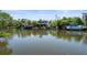 Gorgeous waterfront home with boat dockage and lush green landscaping at 30 Island Cir, Sarasota, FL 34242