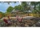 Great backyard space featuring a deck, fire pit, and comfortable seating, ideal for entertaining at 301 W South Ave, Tampa, FL 33603