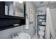 Cozy bathroom showcasing a vanity, toilet, and shower with white tile at 301 W South Ave, Tampa, FL 33603