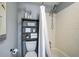 Bathroom featuring vanity, toilet, and shower with white tile at 301 W South Ave, Tampa, FL 33603